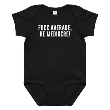 "Fuck Average, Be Mediocre!" printed on a black baby jersey bodysuit laying on a flat surface amongst other clothes