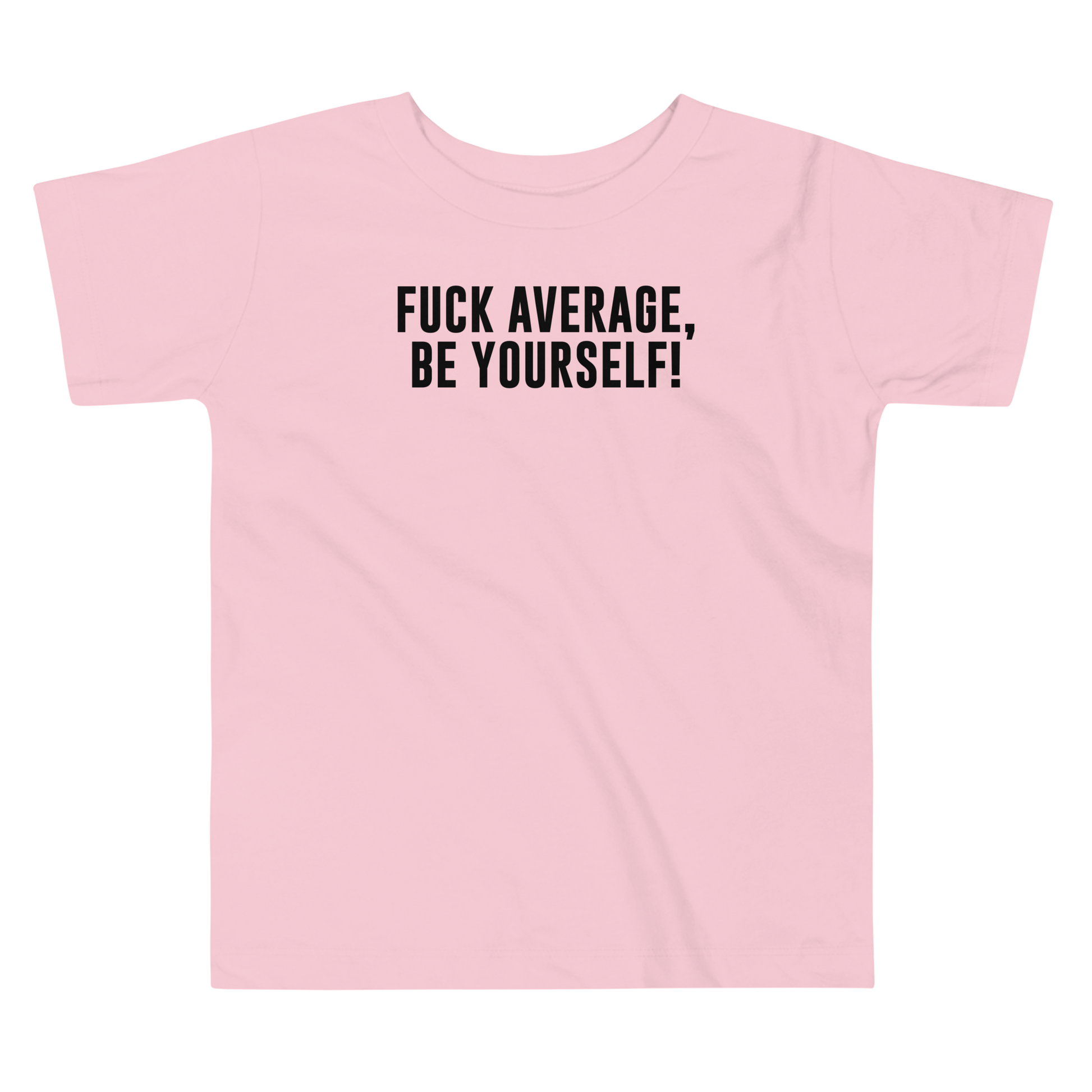 "Fuck Average, Be Yourself!" printed on a pink toddler short sleeve tee laying on a flat surface