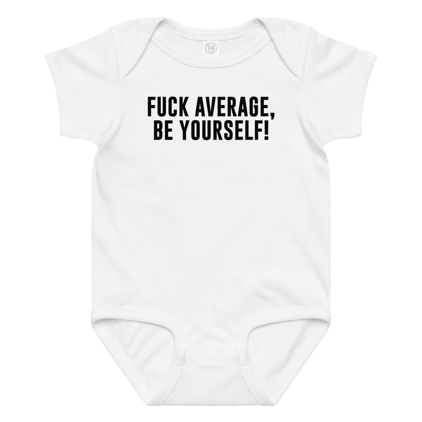 "Fuck Average, Be Yourself!" printed on a white baby jersey bodysuit laying on a flat surface amongst other clothes