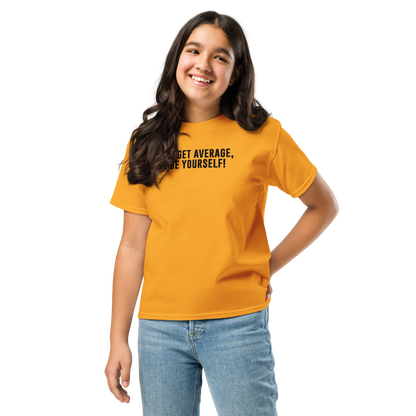 "Forget Average, Be Yourself!" printed on a gold youth classic tee worn by a female