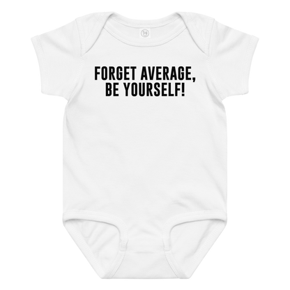 "Forget Average, Be Yourself!" printed on a white baby jersey bodysuit laying on a flat surface amongst other clothes