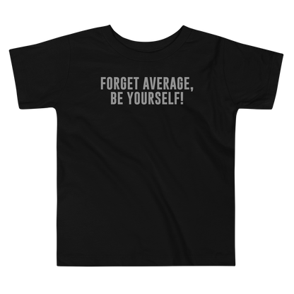 "Forget Average, Be Yourself!" printed on a black toddler short sleeve tee laying on a flat surface