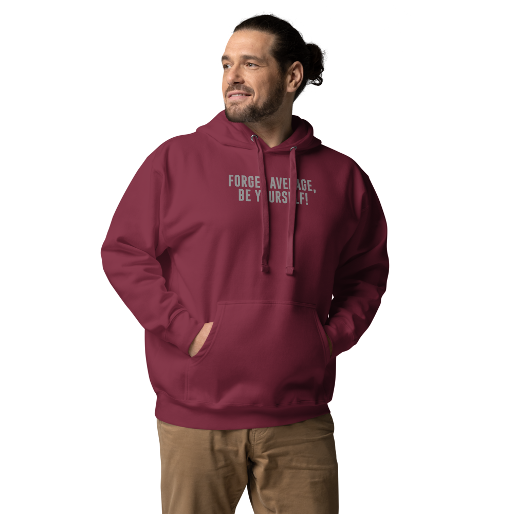 "Forget Average, Be Yourself!" printed on a maroon unisex hoodie worn by a male