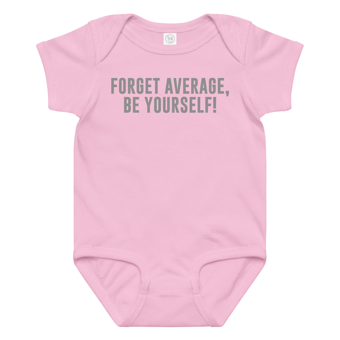 "Forget Average, Be Yourself!" printed on a pink baby jersey bodysuit laying on a flat surface amongst other clothes