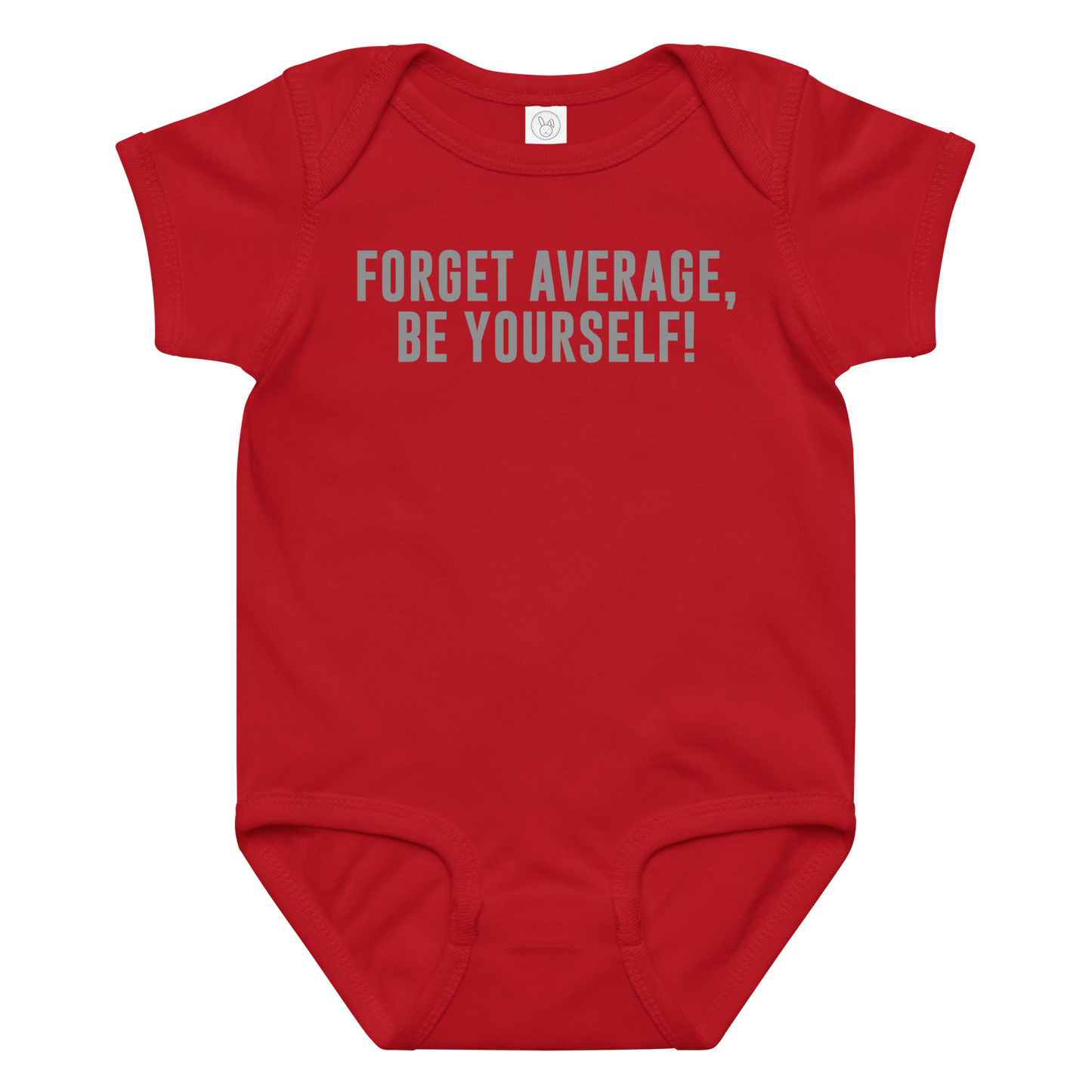 "Forget Average, Be Yourself!" printed on a red baby jersey bodysuit laying on a flat surface amongst other clothes