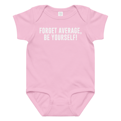 "Forget Average, Be Yourself!" printed on a pink baby jersey bodysuit laying on a flat surface amongst other clothes