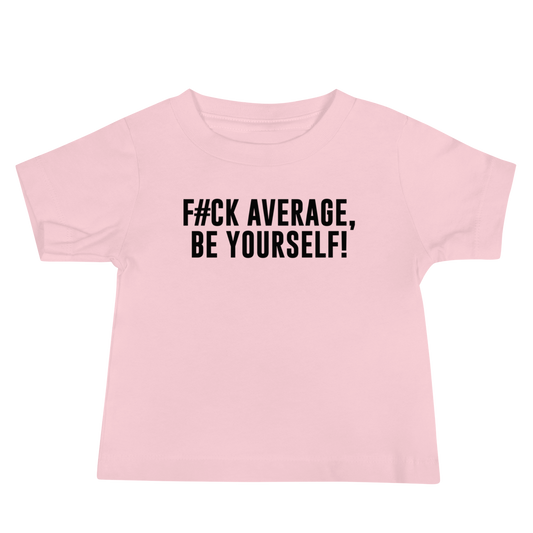 "F#Ck Average, Be Yourself!" printed on a pink baby jersey short sleeve tee laying on a flat surface