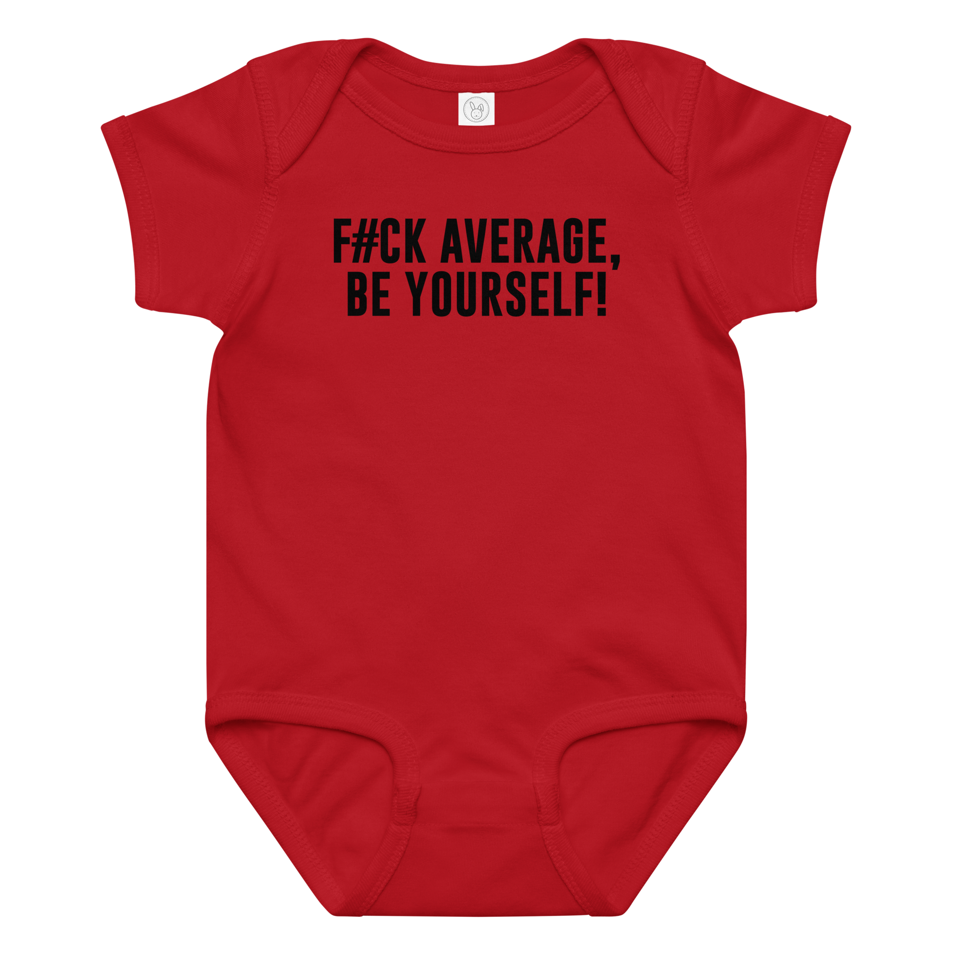 "F#Ck Average, Be Yourself!" printed on a red baby jersey bodysuit laying on a flat surface amongst other clothes
