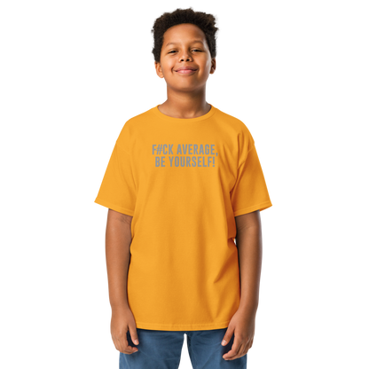 "F#Ck Average, Be Yourself!" printed on a gold youth classic tee worn by a male