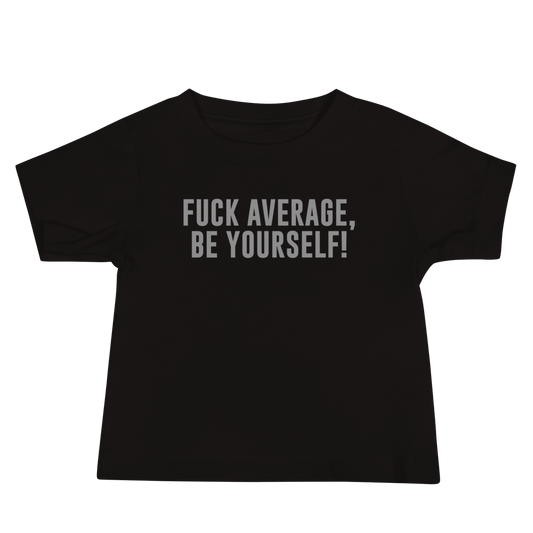"Fuck Average, Be Yourself!" printed on a black baby jersey short sleeve tee laying on a flat surface