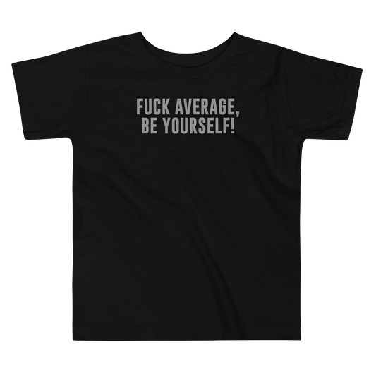 "Fuck Average, Be Yourself!" printed on a black toddler short sleeve tee laying on a flat surface