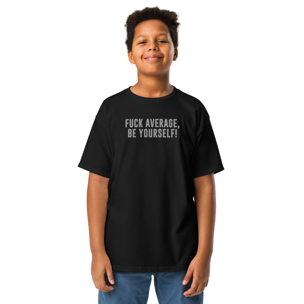 "Fuck Average, Be Yourself!" printed on a black youth classic tee worn by a male