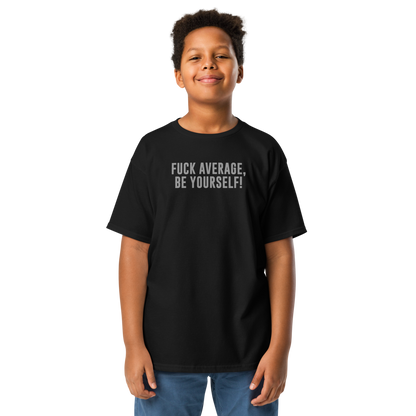 "Fuck Average, Be Yourself!" printed on a black youth classic tee worn by a male