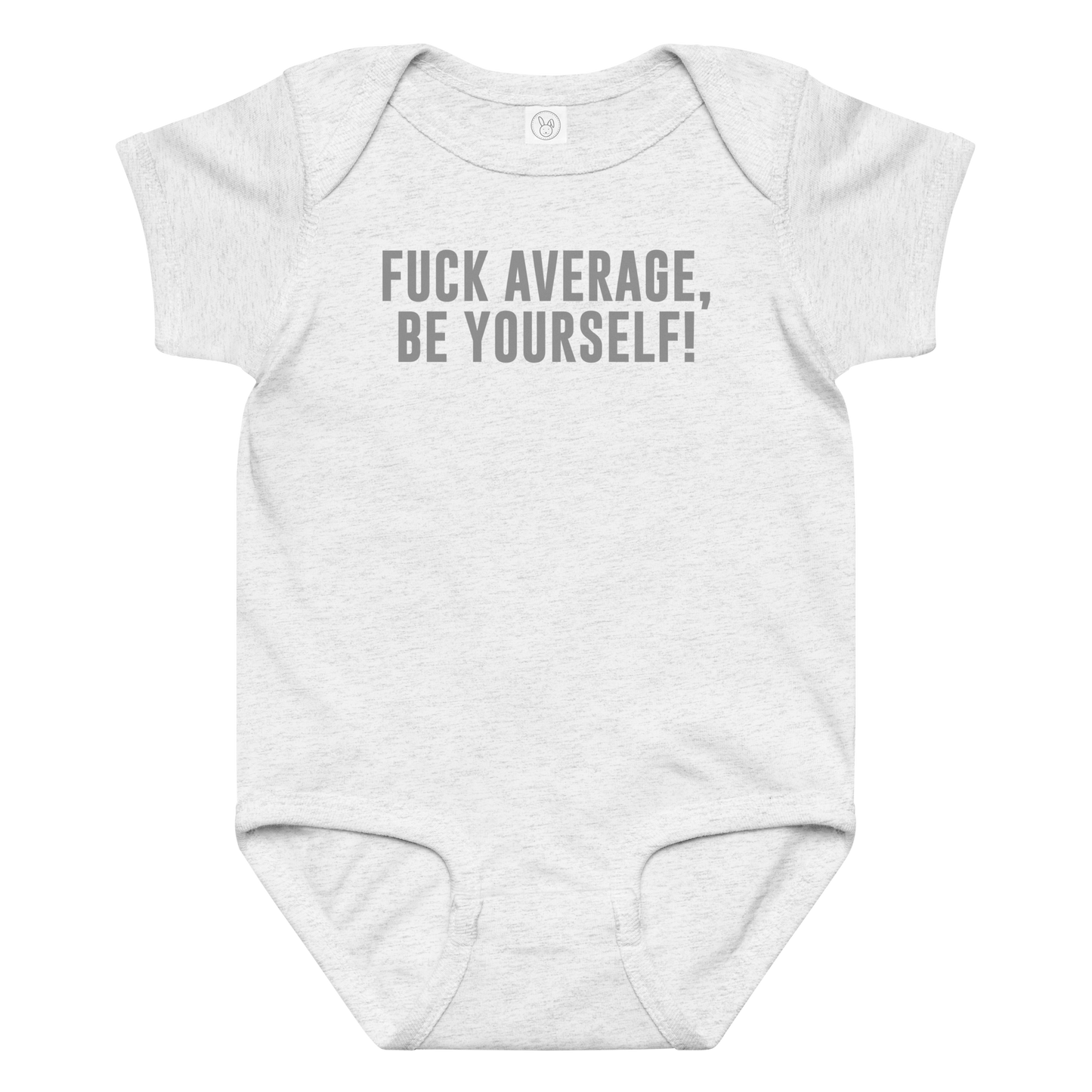 "Fuck Average, Be Yourself!" printed on a ash baby jersey bodysuit laying on a flat surface amongst other clothes
