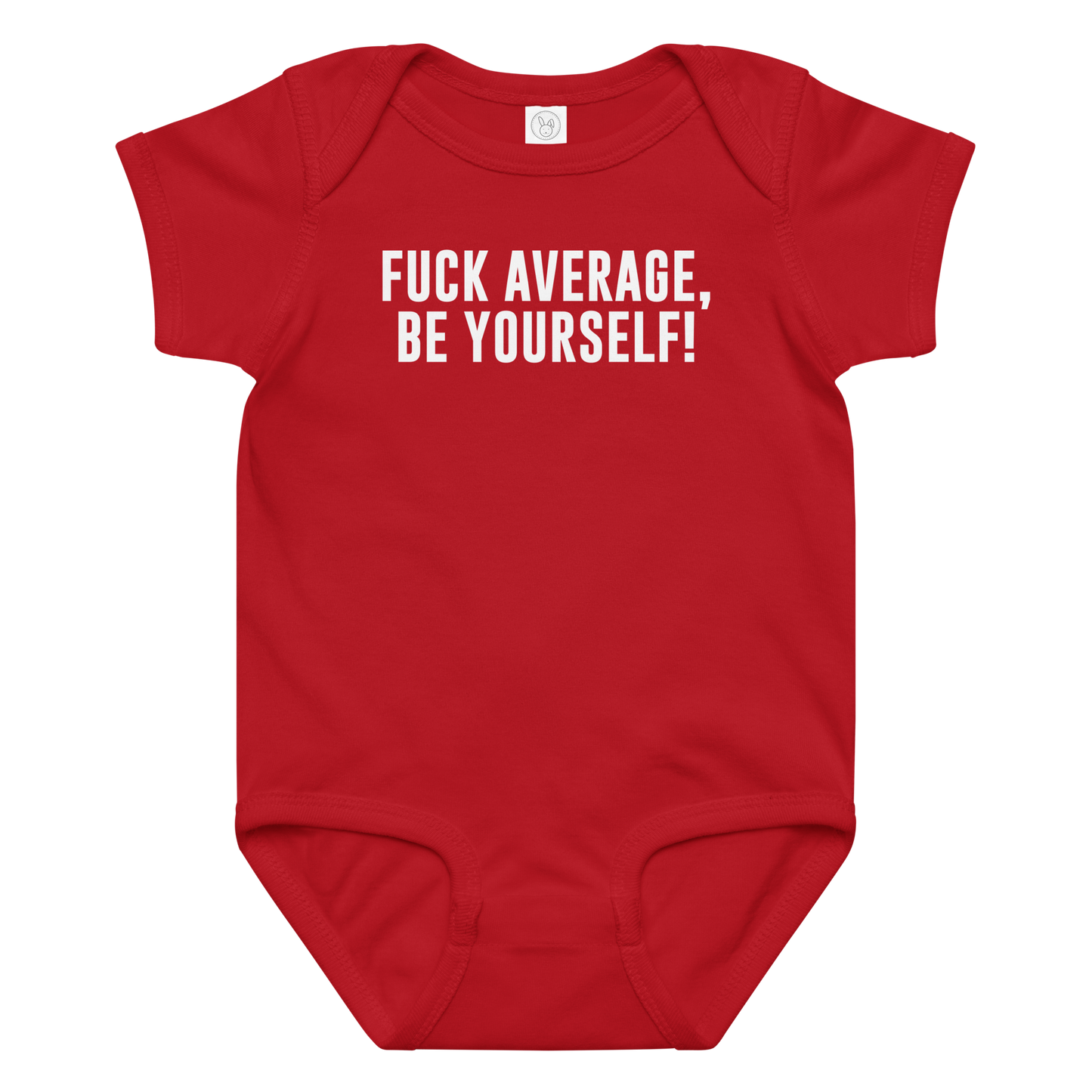 "Fuck Average, Be Yourself!" printed on a red baby jersey bodysuit laying on a flat surface amongst other clothes