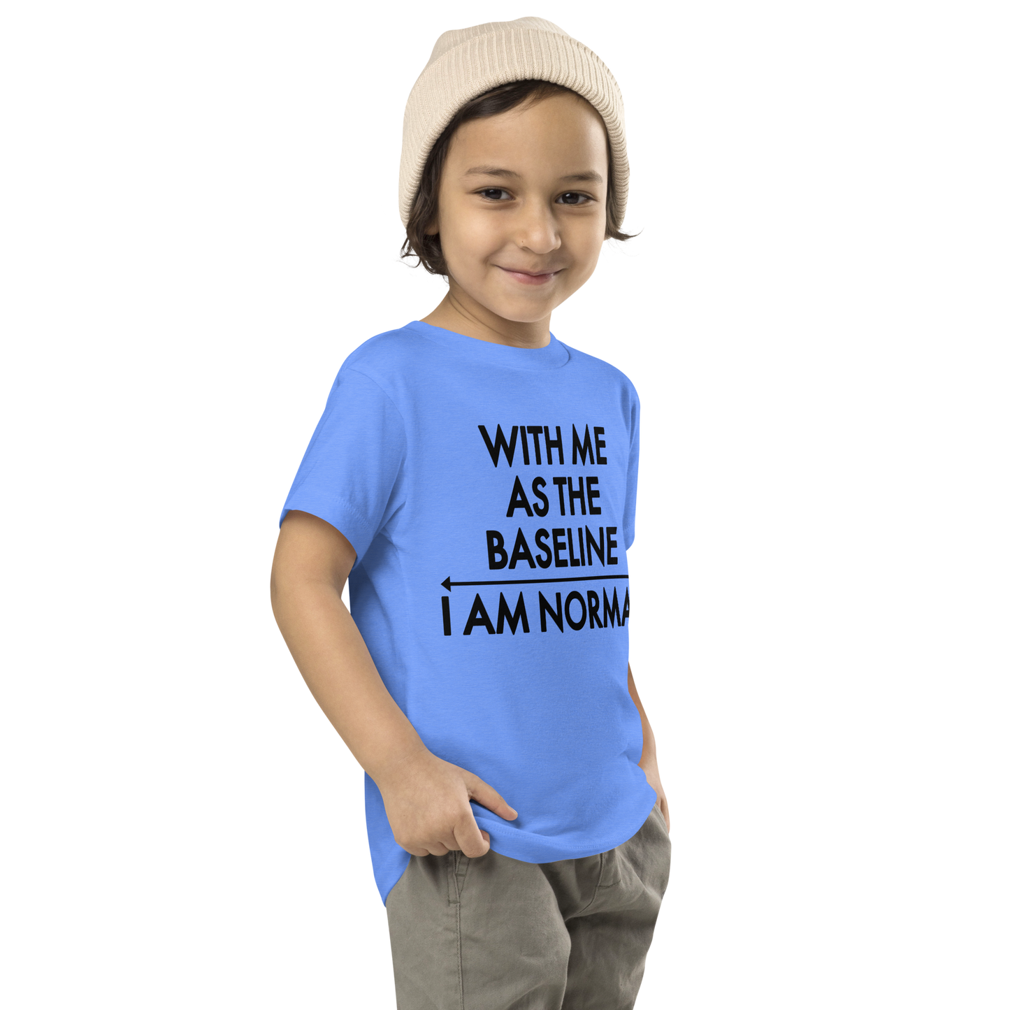 "With me as the baseline, I am normal" printed on a heather columbia blue toddler short sleeve tee worn by a male who is also wearing a knit cap