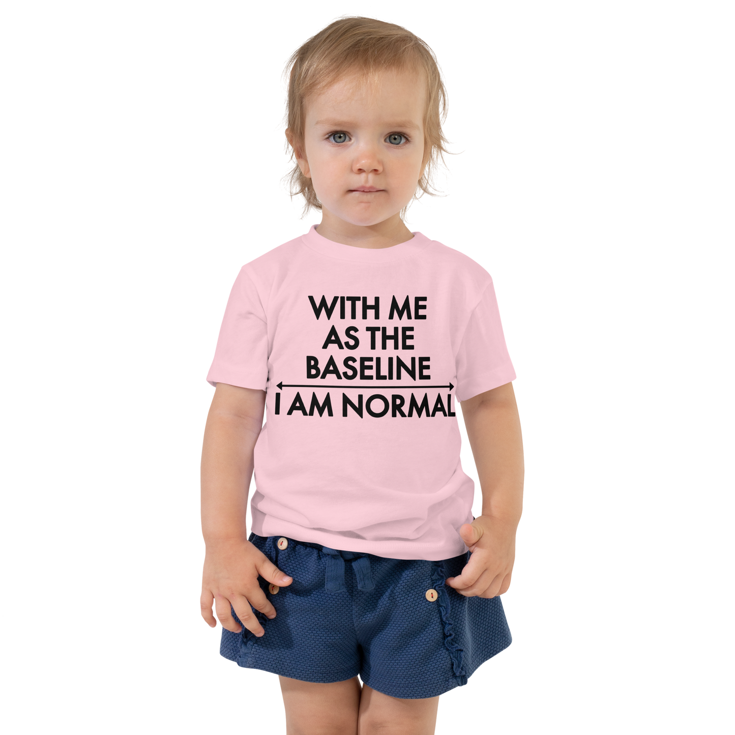 "With me as the baseline, I am normal" printed on a pink toddler short sleeve tee worn by a female