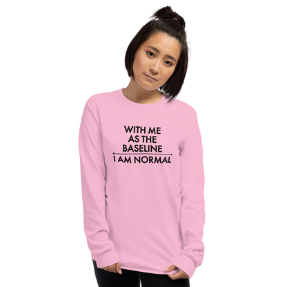 "With me as the baseline, I am normal" printed on a light pink men's long sleeve shirt worn by a female