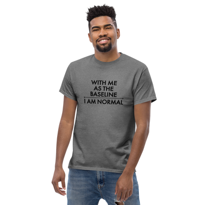 "With me as the baseline, I am normal" printed on a graphite heather unisex classic tee worn by a male