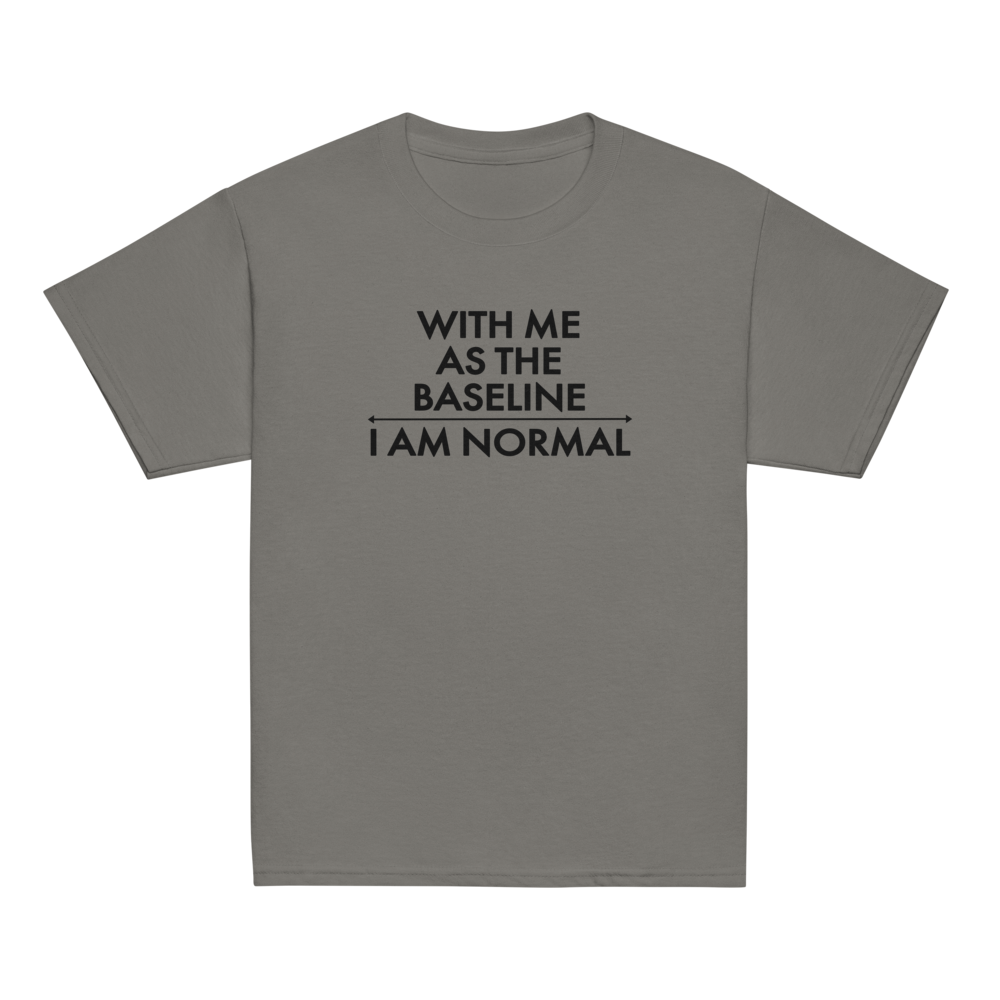 "With me as the baseline, I am normal" printed on a charcoal youth classic tee laying on a flat surface