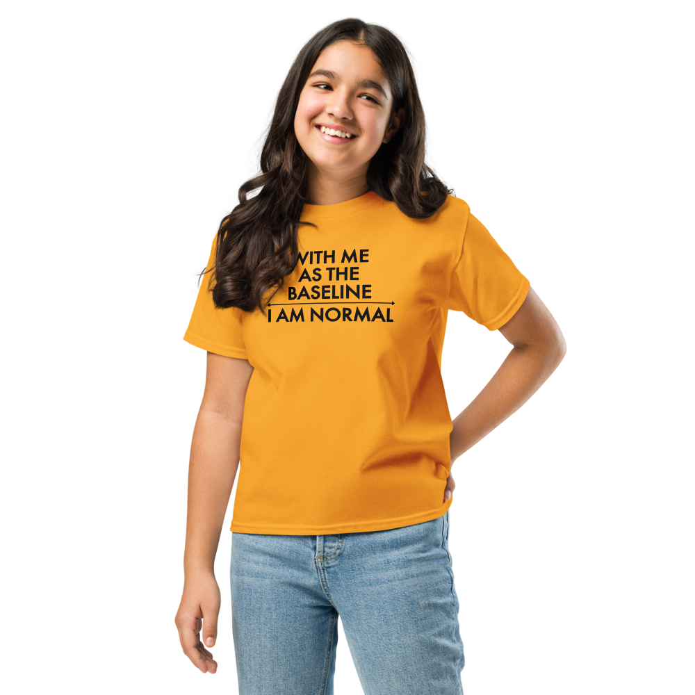"With me as the baseline, I am normal" printed on a gold youth classic tee worn by a female