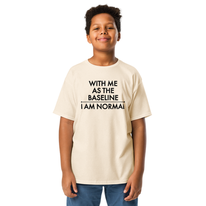 "With me as the baseline, I am normal" printed on a natural youth classic tee worn by a male