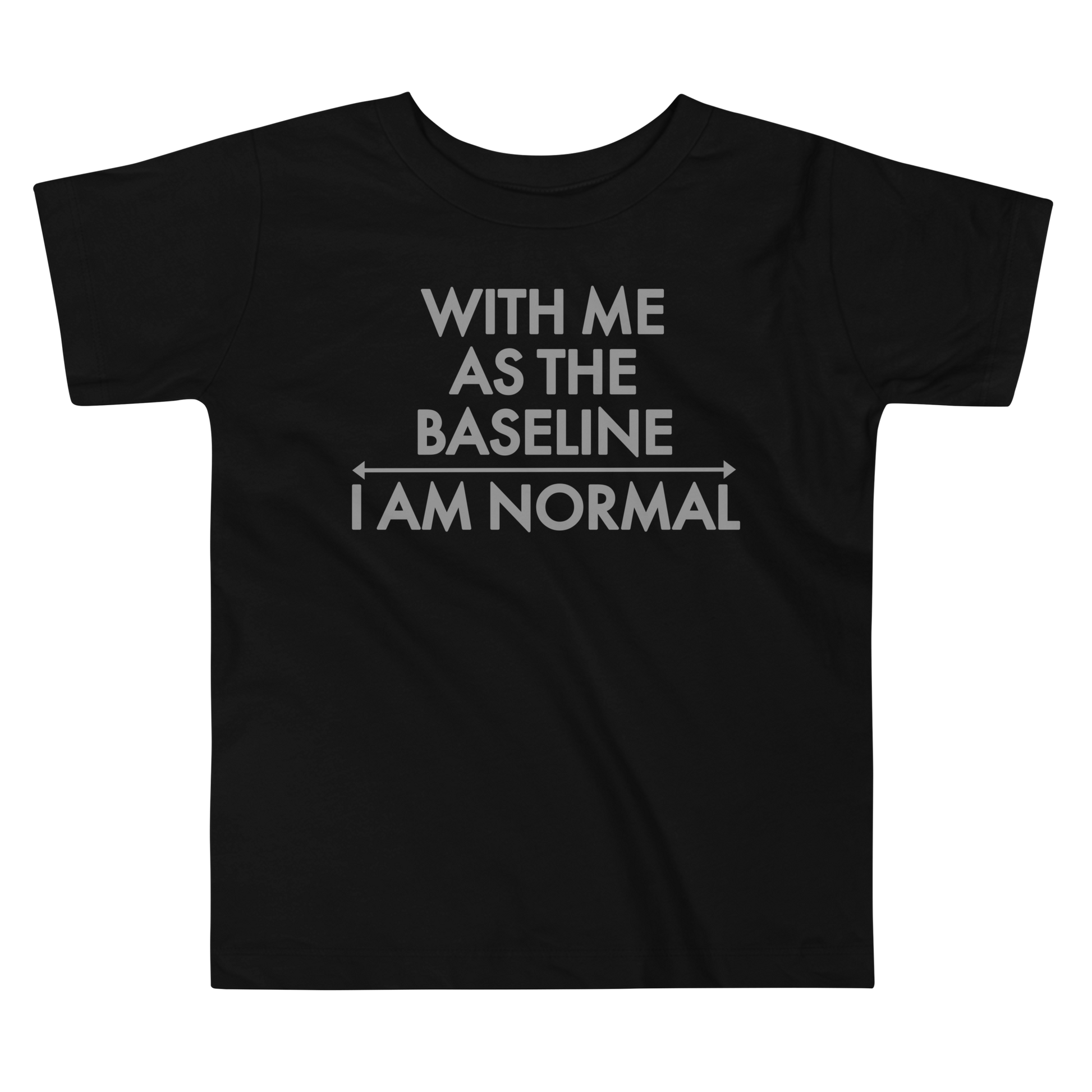 "With me as the baseline, I am normal" printed on a black toddler short sleeve tee laying on a flat surface