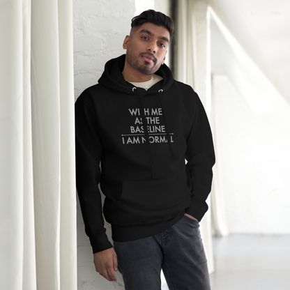"With me as the baseline, I am normal" printed on a black unisex hoodie worn by a male
