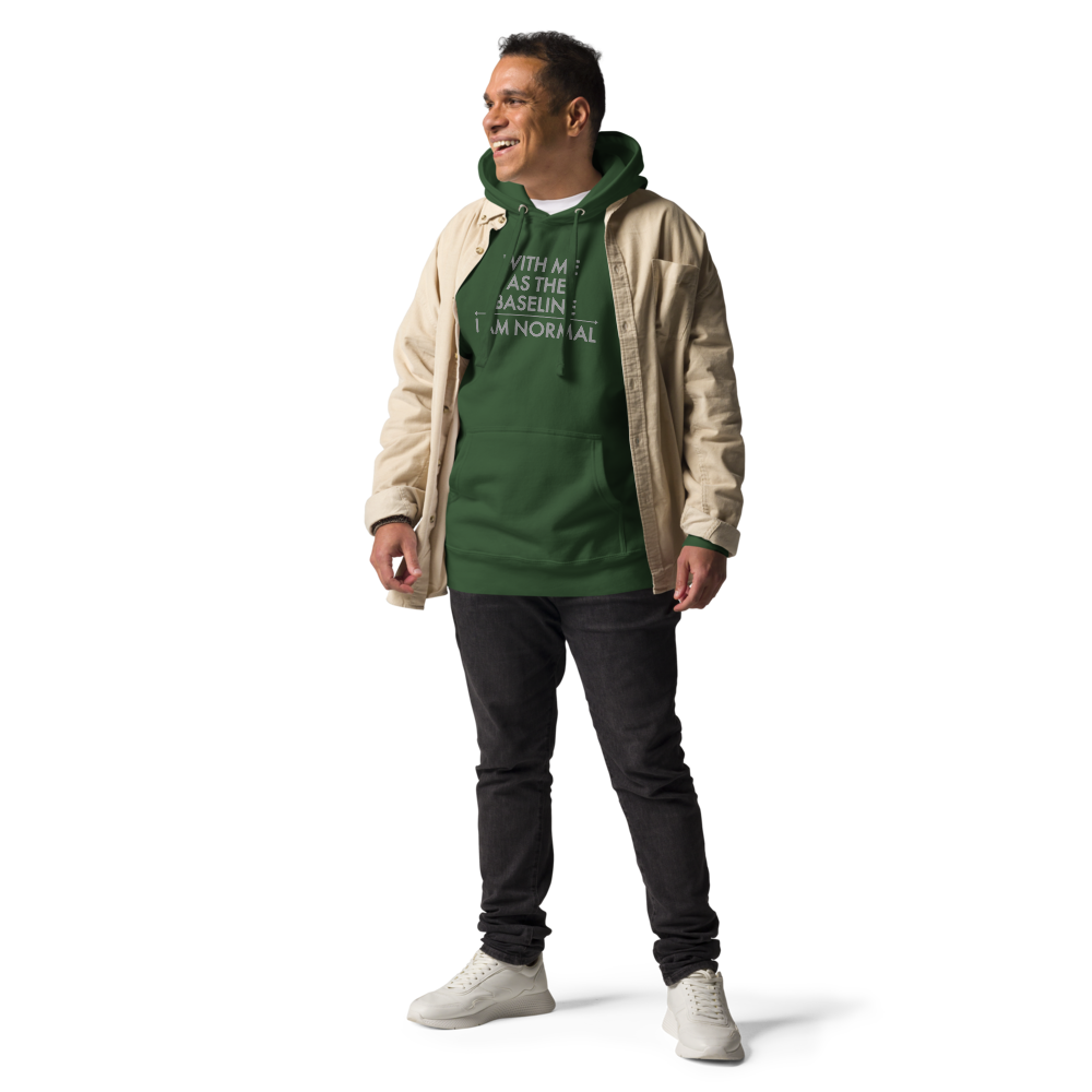 "With me as the baseline, I am normal" printed on a forest green unisex hoodie worn by a male with a jacket on top
