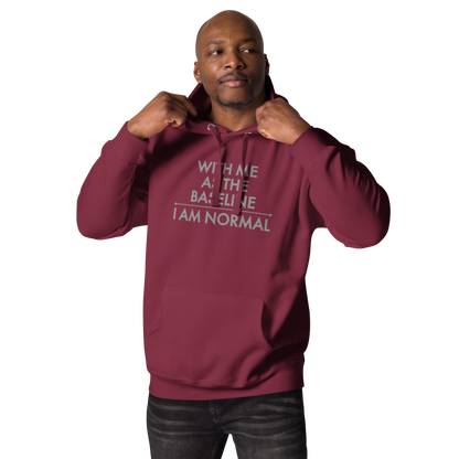 "With me as the baseline, I am normal" printed on a maroon unisex hoodie worn by a male