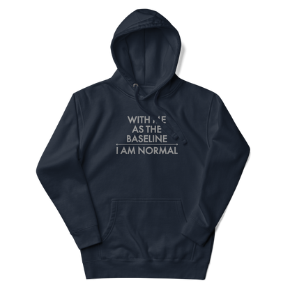 "With me as the baseline, I am normal" printed on a navy blazer unisex hoodie laying on a flat surface with the hood up
