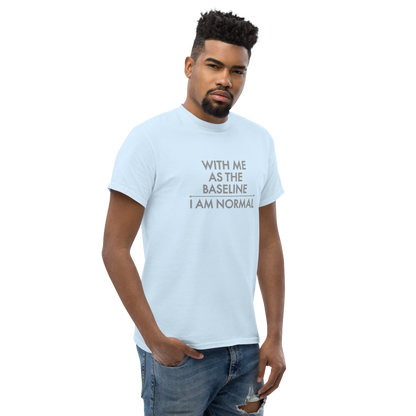 "With me as the baseline, I am normal" printed on a light blue unisex classic tee worn by a male