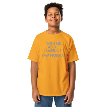 "With me as the baseline, I am normal" printed on a gold youth classic tee worn by a male
