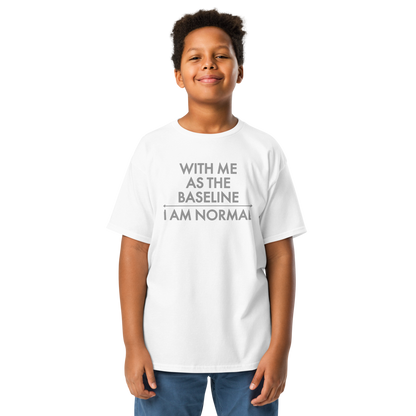 "With me as the baseline, I am normal" printed on a white youth classic tee worn by a male