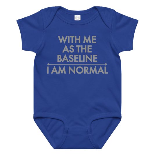 "With me as the baseline, I am normal" printed on a royal baby jersey bodysuit laying on a flat surface amongst other clothes