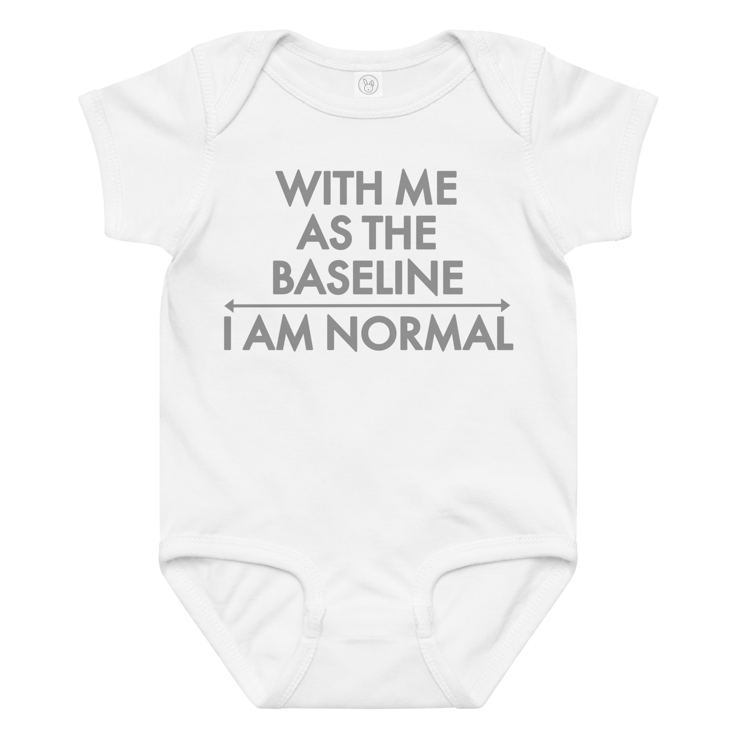 "With me as the baseline, I am normal" printed on a white baby jersey bodysuit laying on a flat surface amongst other clothes