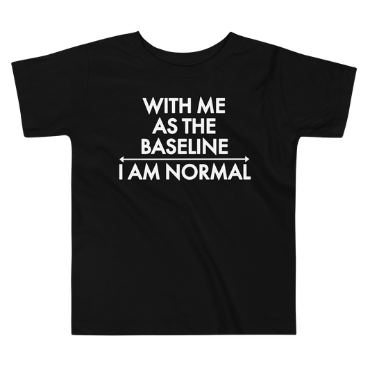 "With me as the baseline, I am normal" printed on a black toddler short sleeve tee laying on a flat surface