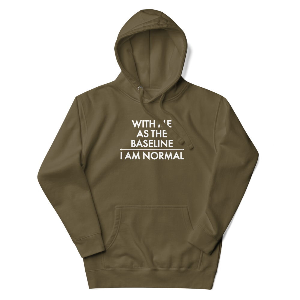 "With me as the baseline, I am normal" printed on a military green unisex hoodie laying on a flat surface with the hood up