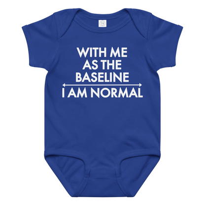 "With me as the baseline, I am normal" printed on a royal baby jersey bodysuit laying on a flat surface amongst other clothes