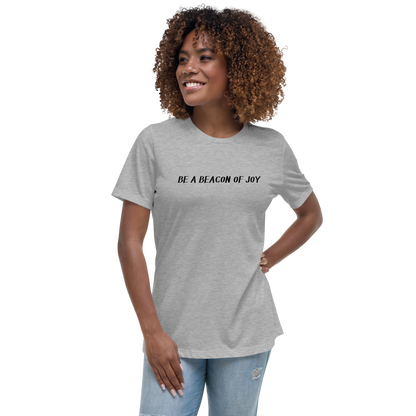 "Be a beacon of joy" printed on a athletic heather women's relaxed t-shirt worn by a female