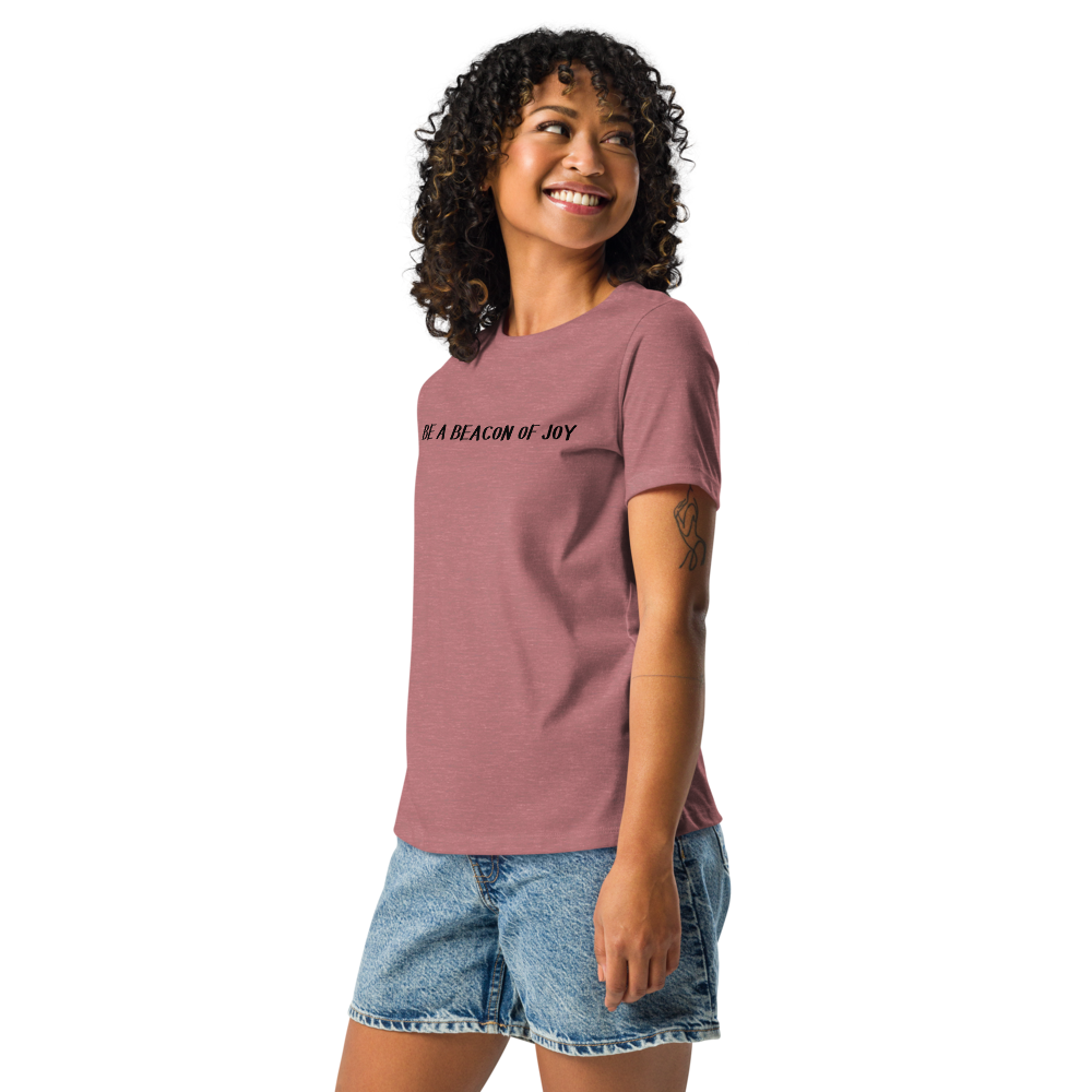 "Be a beacon of joy" printed on a heather mauve women's relaxed t-shirt worn by a female