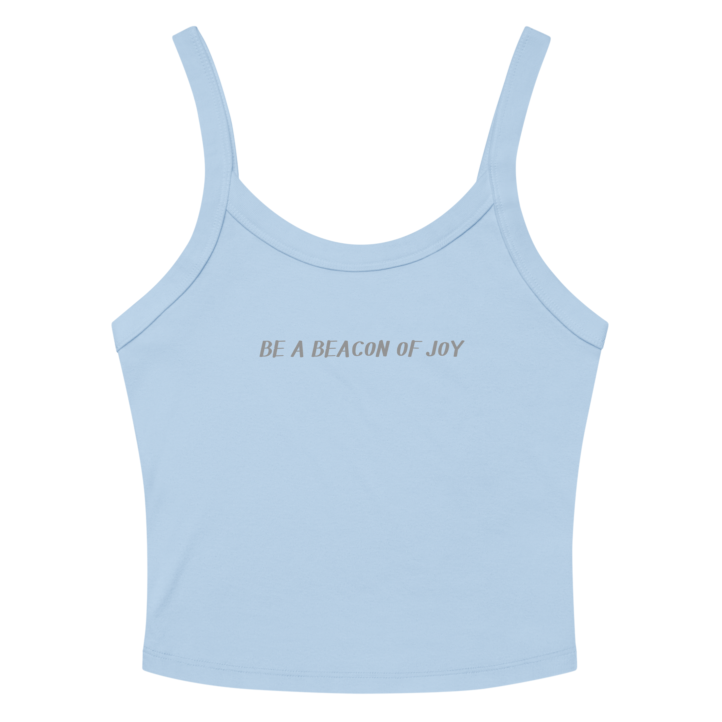 "Be a beacon of joy" printed on a solid baby blue blend women's micro-rib tanktop laying on a flat surface amongst sunglasses and shorts