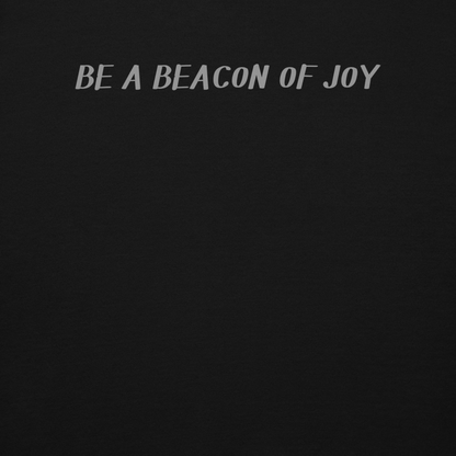 "Be a beacon of joy" printed on a black background