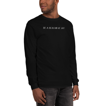 "Be a beacon of joy" printed on a black men's long sleeve shirt worn by a male