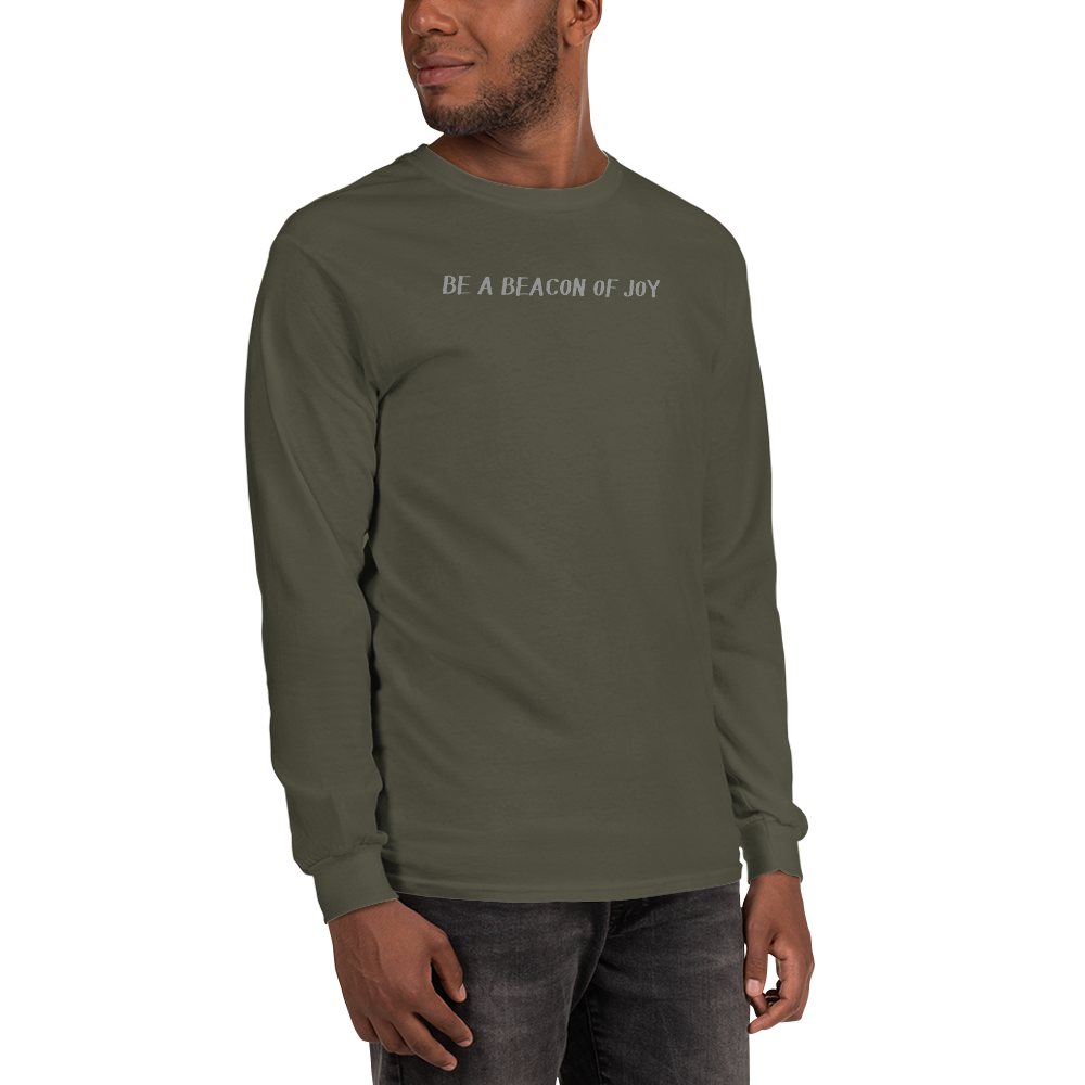 "Be a beacon of joy" printed on a military green men's long sleeve shirt worn by a male