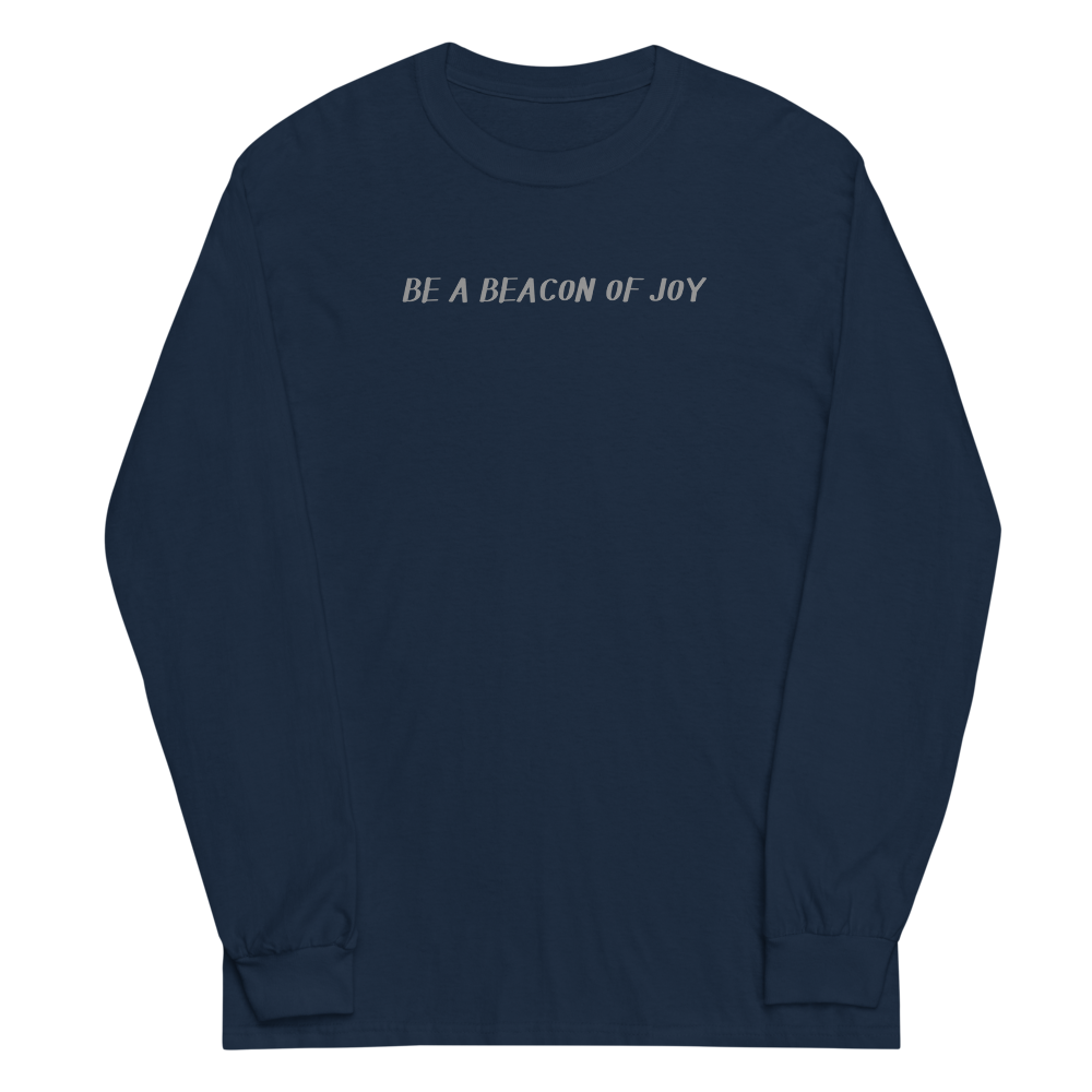 "Be a beacon of joy" printed on a navy men's long sleeve shirt laying on a flat surface