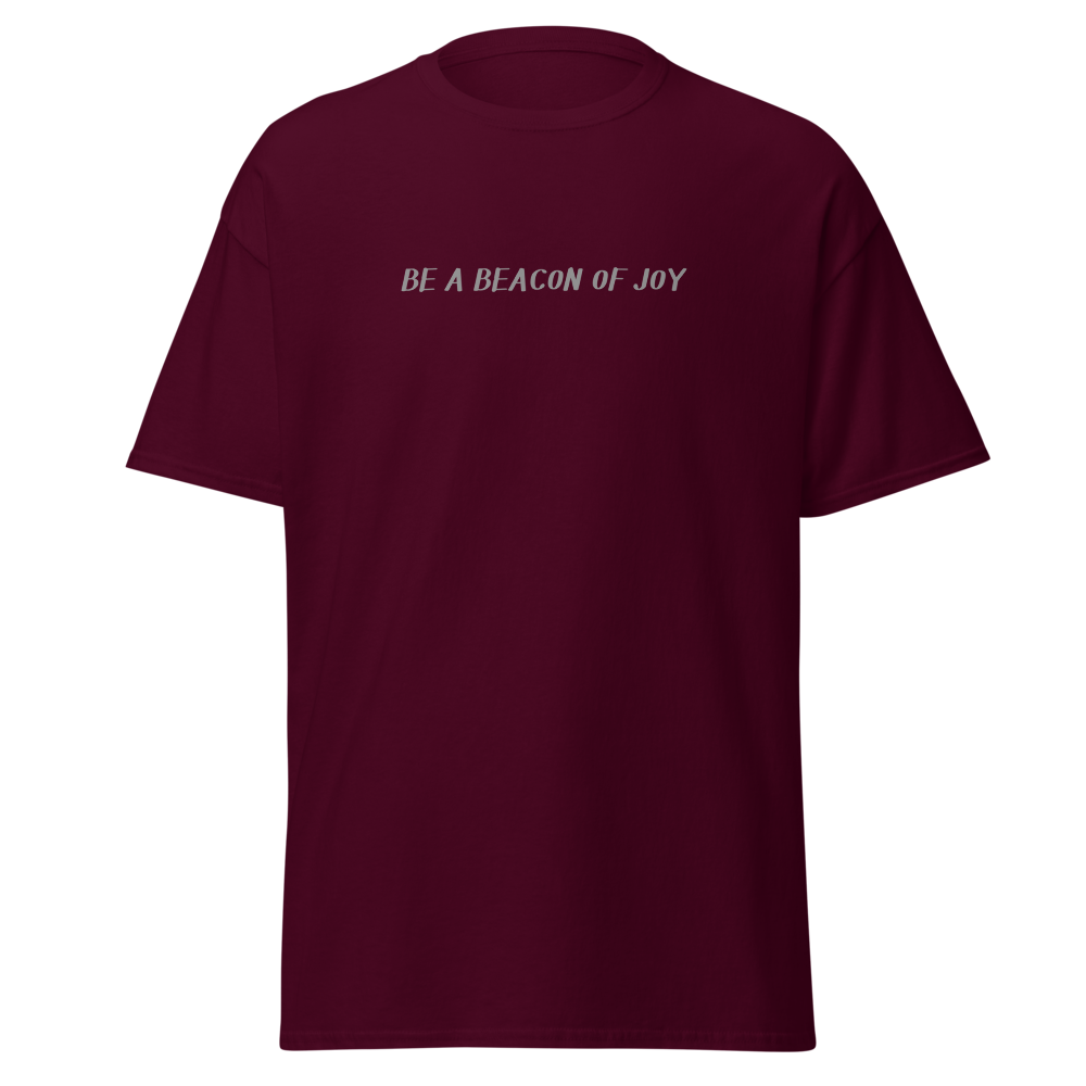"Be a beacon of joy" printed on a maroon on an invisible body