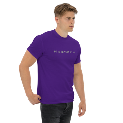 "Be a beacon of joy" printed on a purple unisex classic tee worn by a male