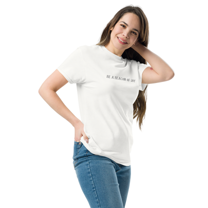 "Be a beacon of joy" printed on a white unisex classic tee worn by a female