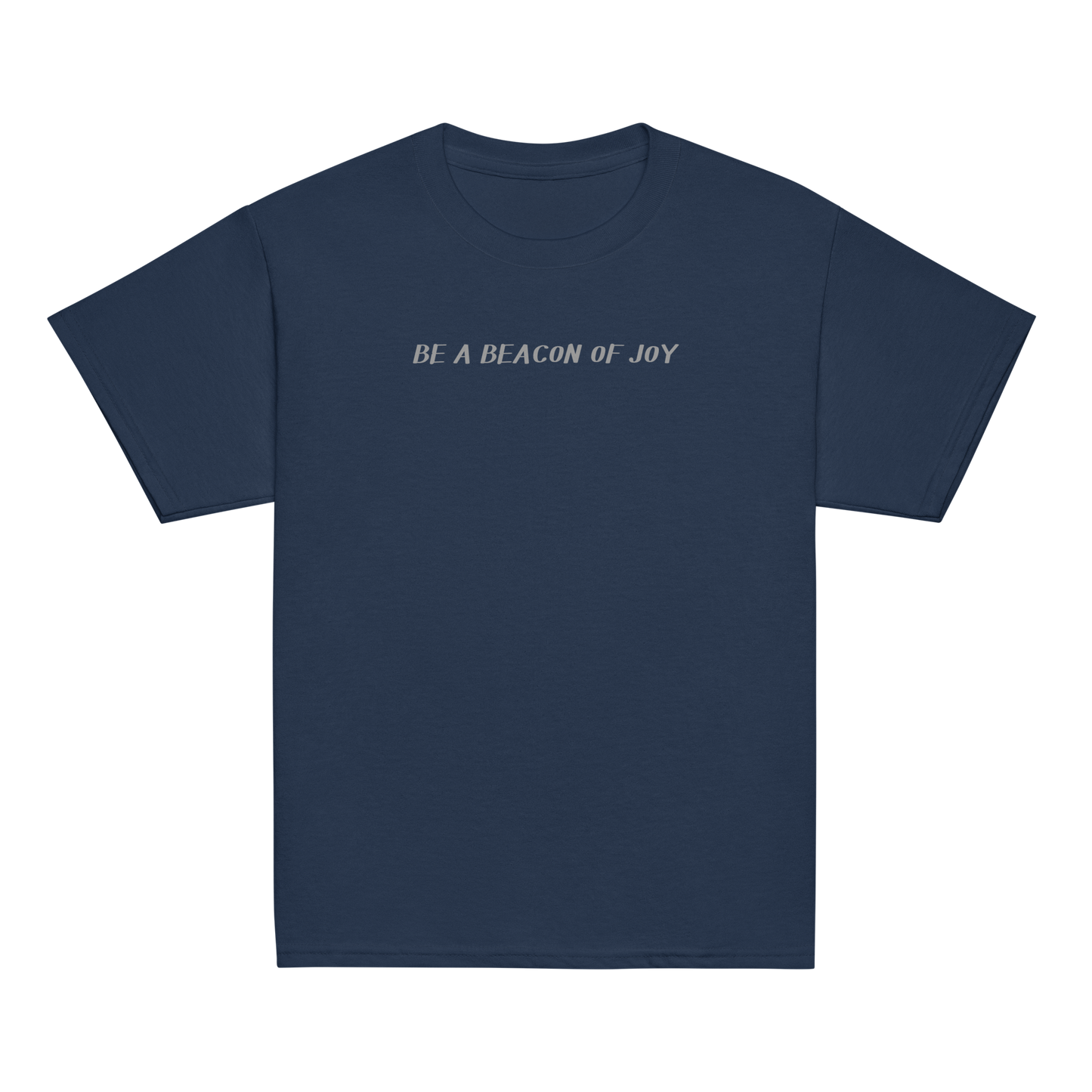 "Be a beacon of joy" printed on a navy youth classic tee laying on a flat surface